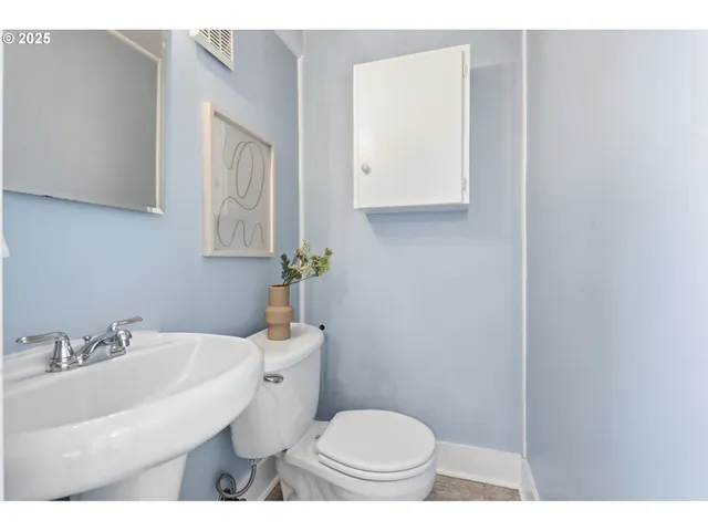 a view of an empty room with wooden walls