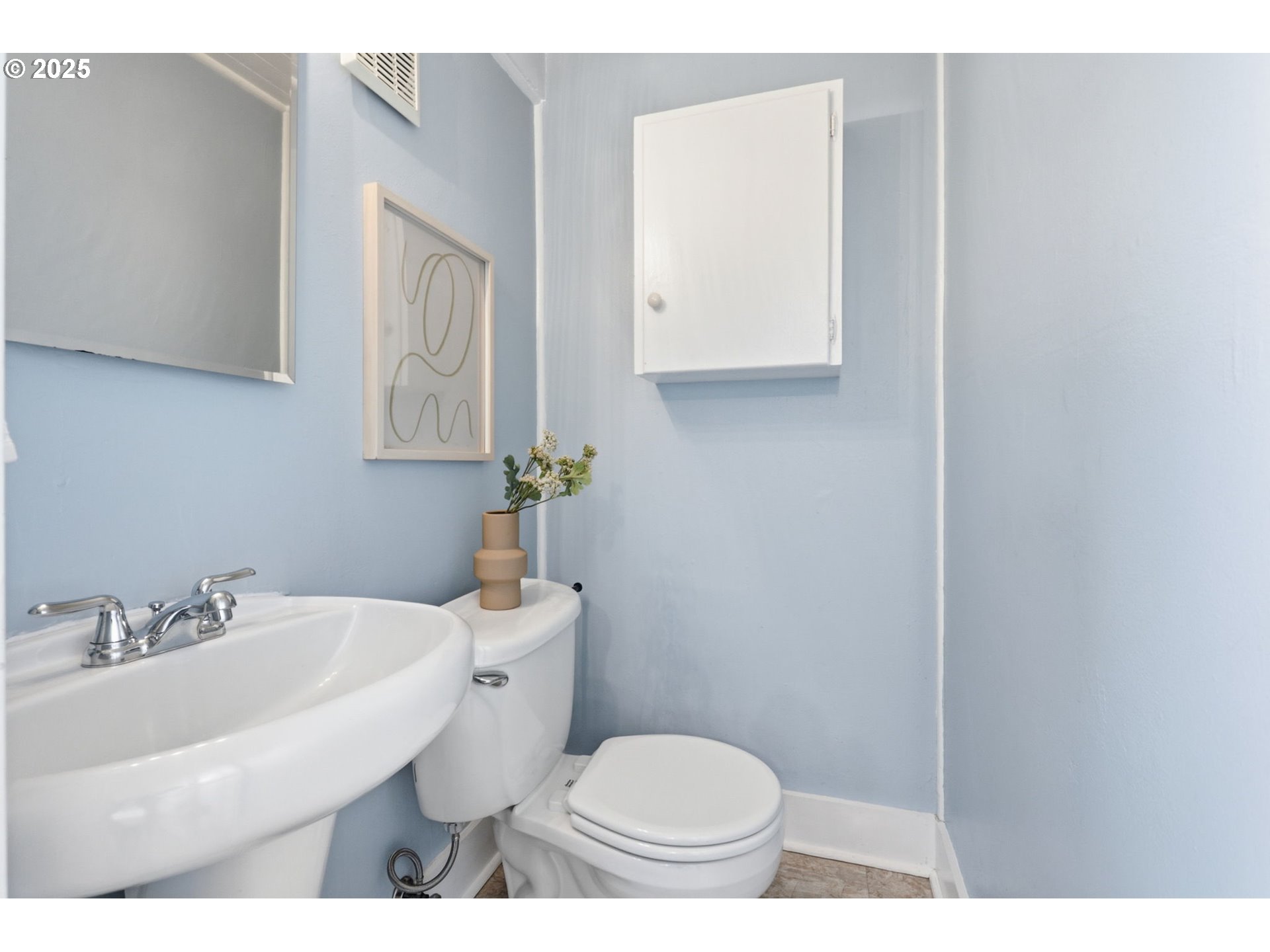 954 Northeast Emerson Street Portland, OR 97211 - Photo 29 of 47 a bathroom with a sink toilet and vanity