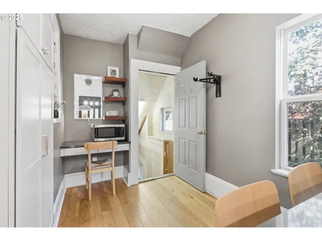 a view of a living room and entryway