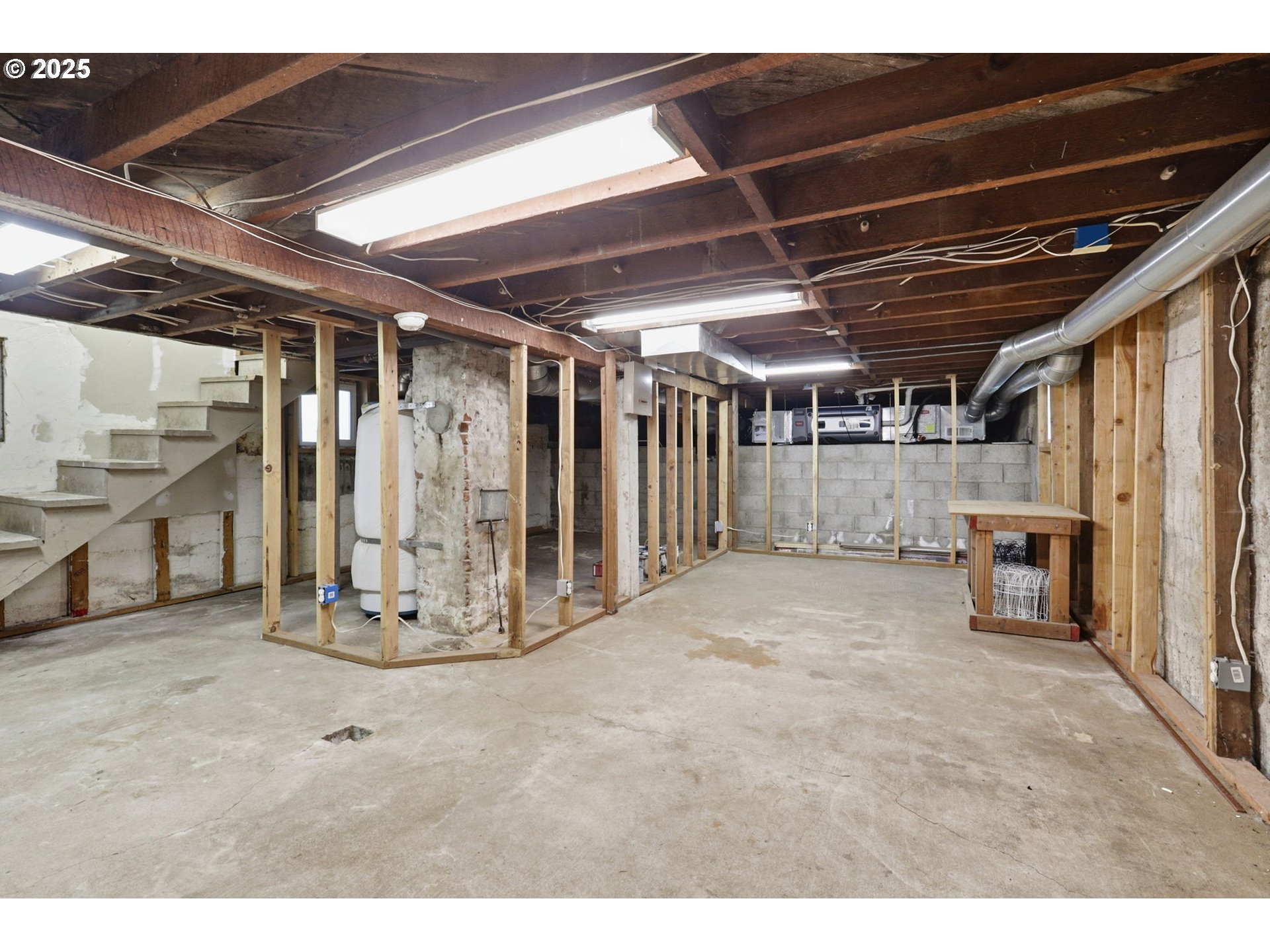 954 Northeast Emerson Street Portland, OR 97211 - Photo 31 of 47 a view of an empty room with wooden walls