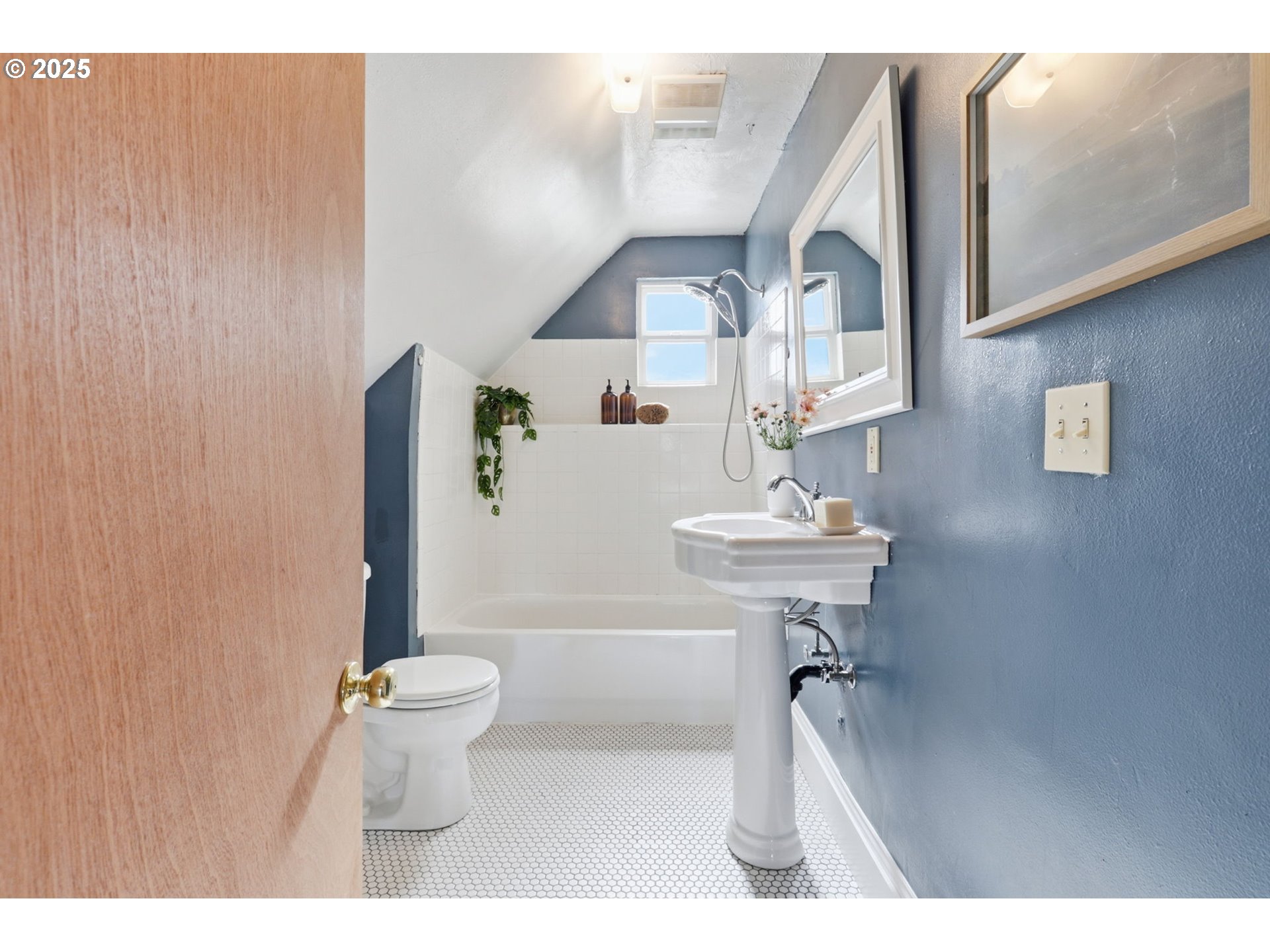 954 Northeast Emerson Street Portland, OR 97211 - Photo 34 of 47 a bathroom with a sink a toilet and a mirror