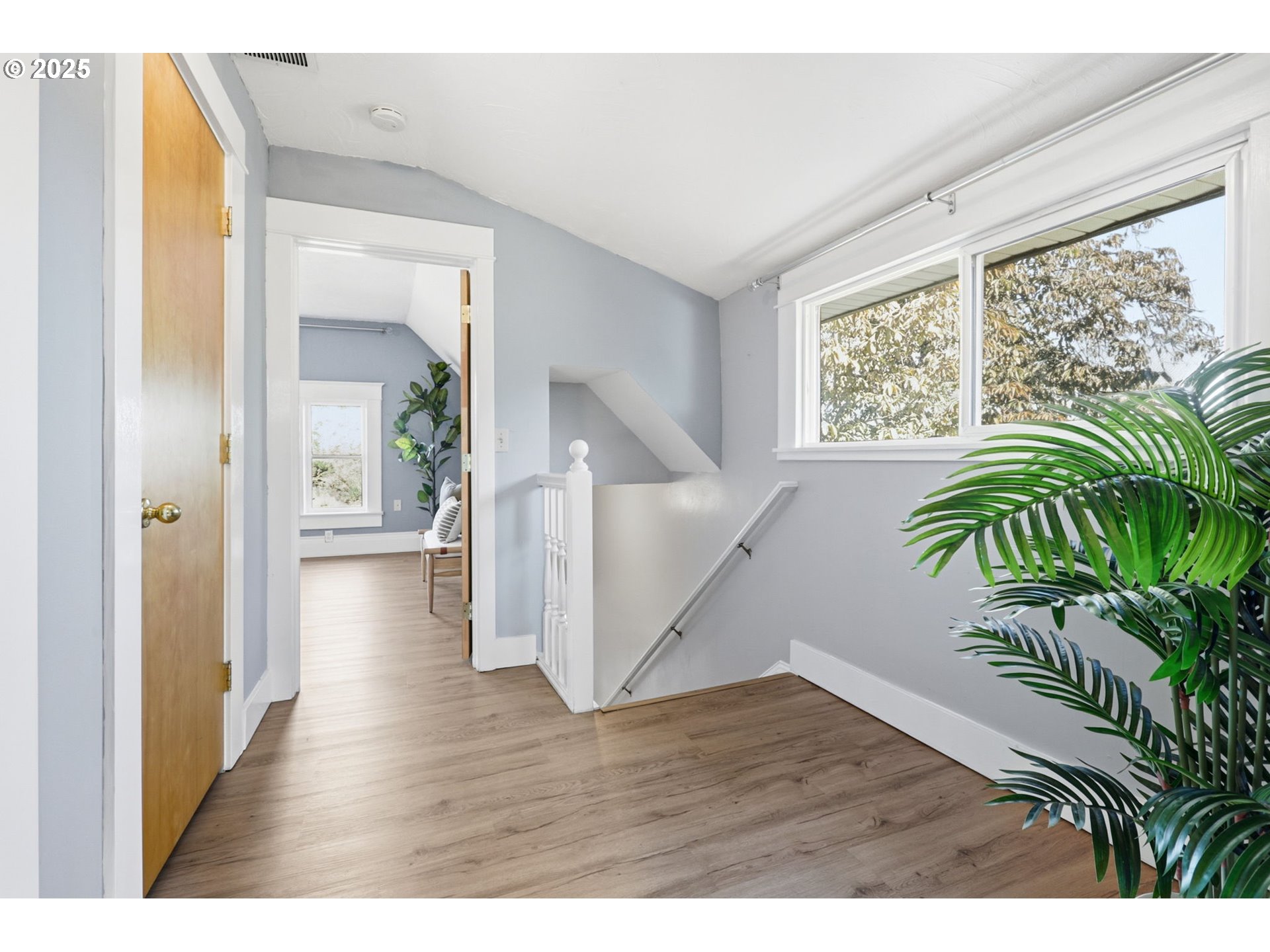 954 Northeast Emerson Street Portland, OR 97211 - Photo 38 of 47 a view interior of a house wooden floor and a potted plant