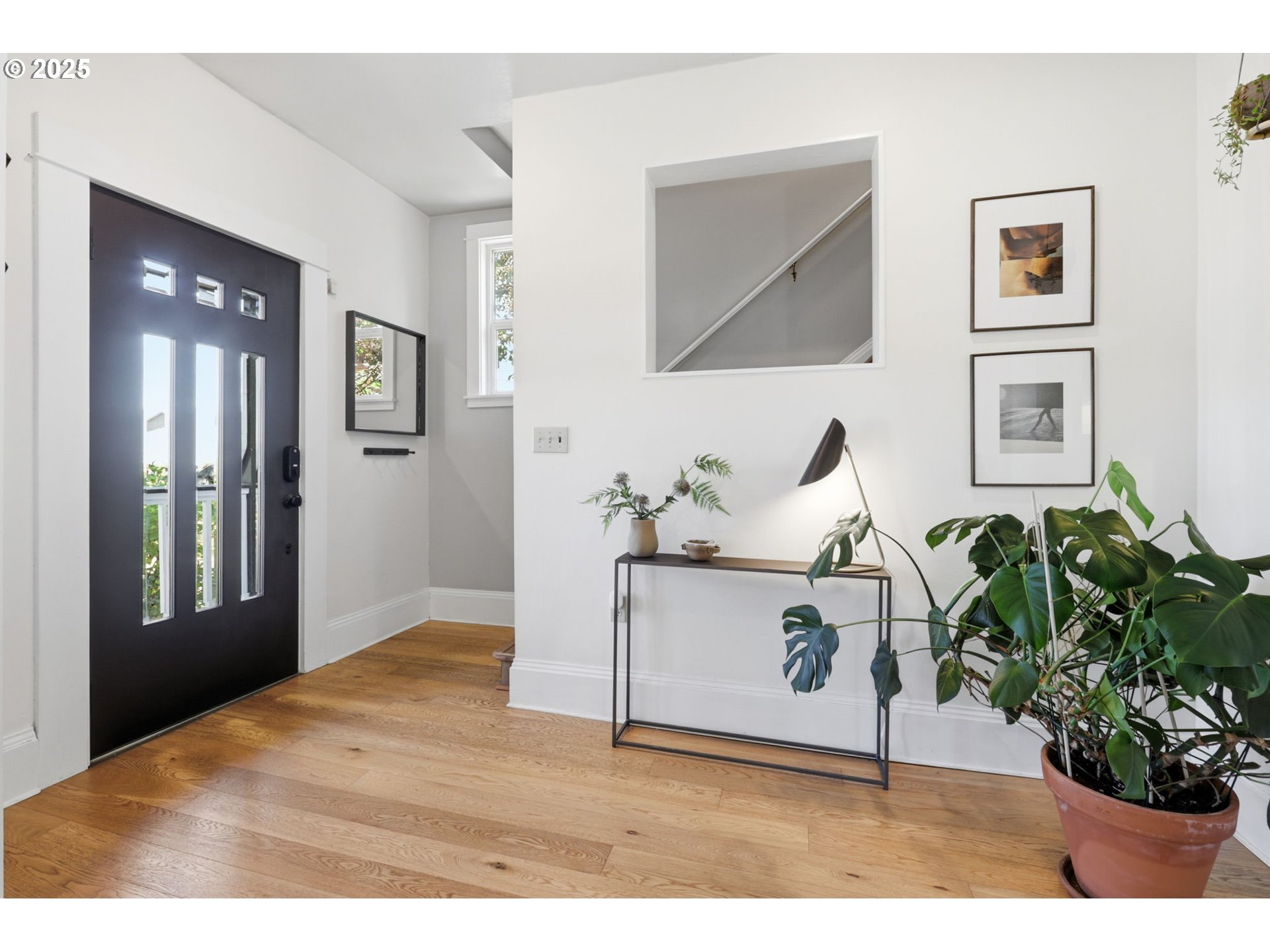 954 Northeast Emerson Street Portland, OR 97211 - Photo 4 of 47 a living room with furniture and a potted plant