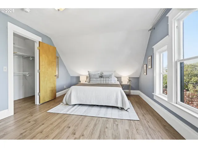 a backyard of a house with wooden floor chairs and wooden fence