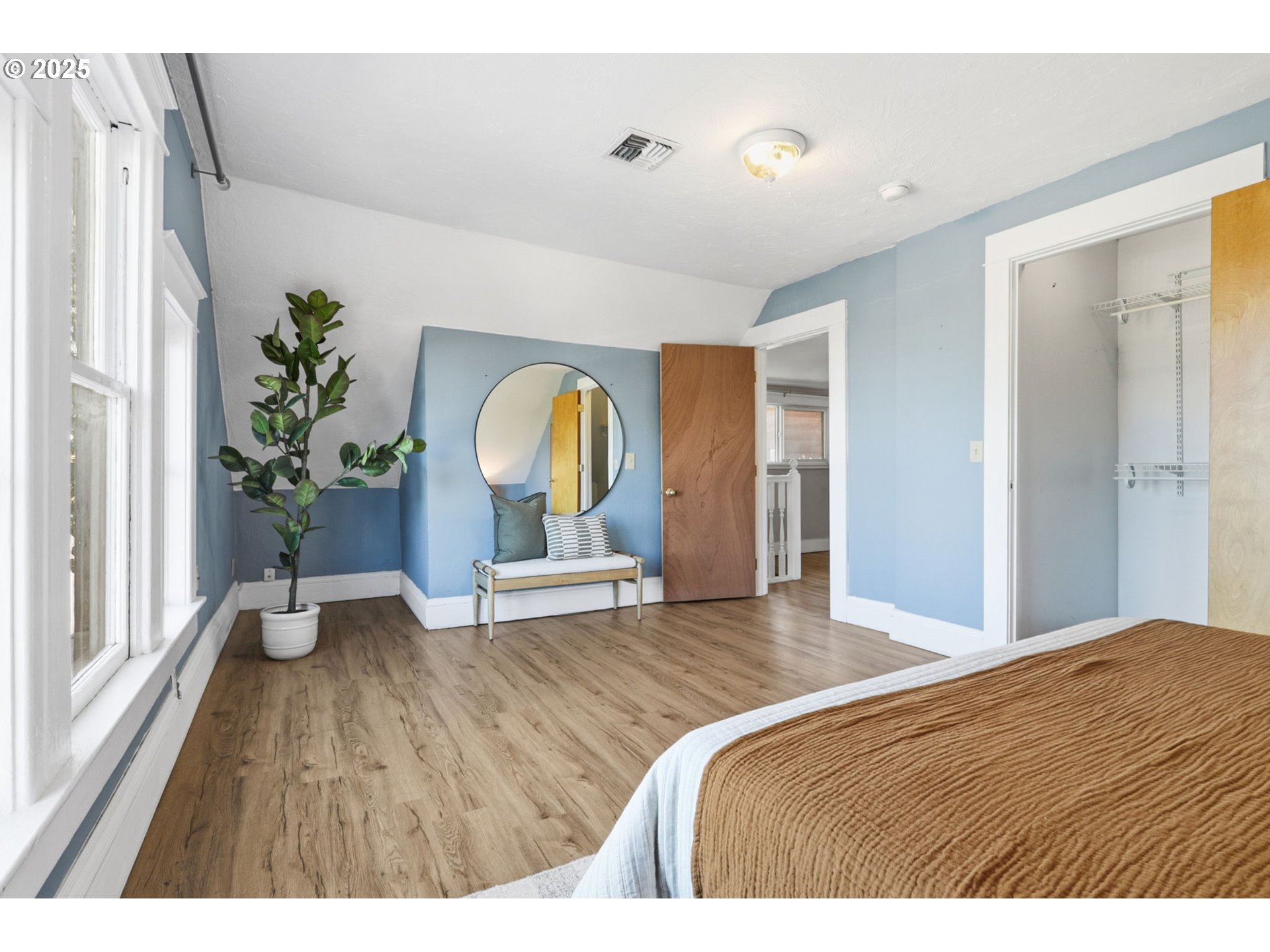 954 Northeast Emerson Street Portland, OR 97211 - Photo 42 of 47 a bedroom with a bed and a potted plant