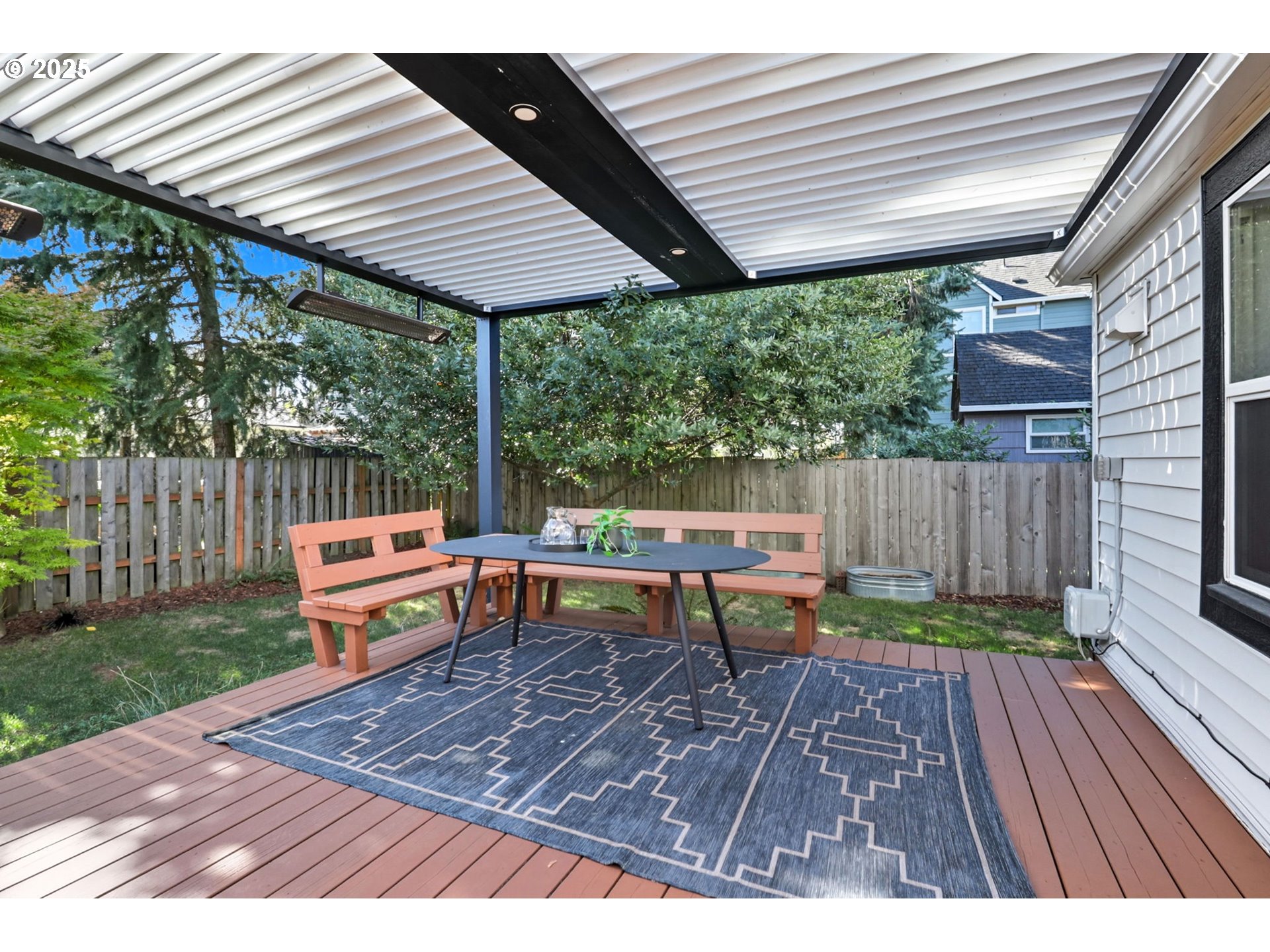 954 Northeast Emerson Street Portland, OR 97211 - Photo 43 of 47 a backyard of a house with wooden floor chairs and wooden fence
