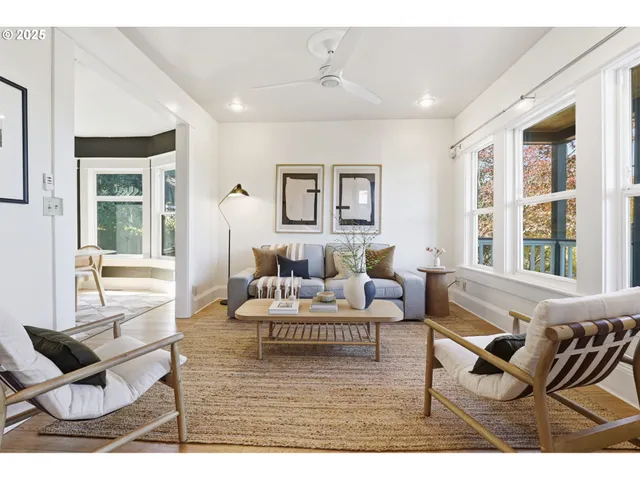 a living room with furniture and a table