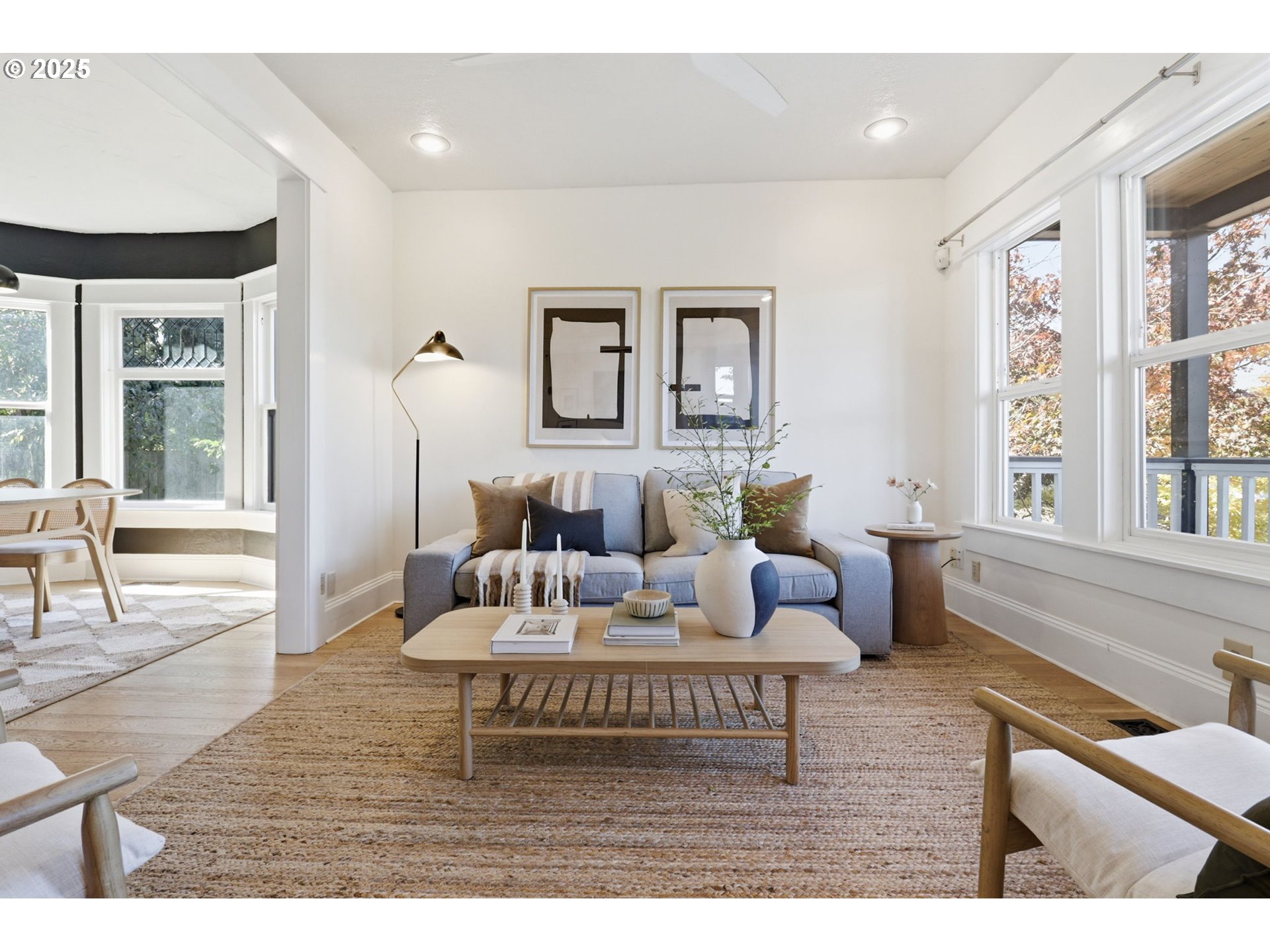 954 Northeast Emerson Street Portland, OR 97211 - Photo 9 of 47 a living room with furniture and a large window