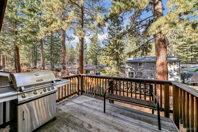 a view of a balcony with wooden fence and floor