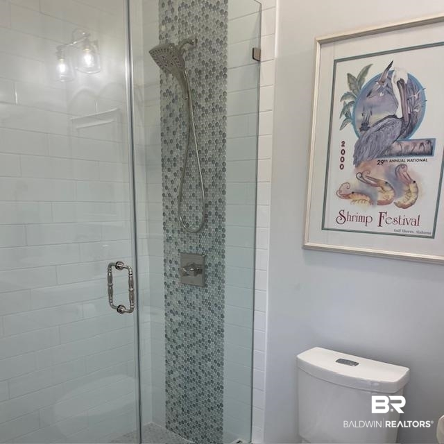 32937 River Road Orange Beach, AL 36561 - Photo 36 of 42 Bathroom with a shower with door and toilet