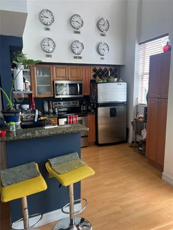 a kitchen with furniture and a fireplace