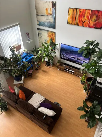 a room with furniture and a potted plant
