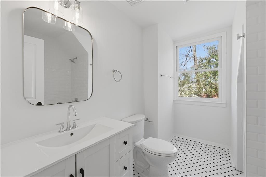2415 Charleston Oaks Lane Decatur, GA 30030 - Photo 20 of 55 a bathroom with a sink a toilet and shower