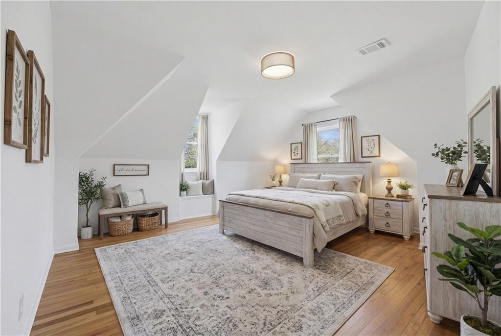2415 Charleston Oaks Lane Decatur, GA 30030 - Photo 23 of 55 a spacious bedroom with a bed and a table