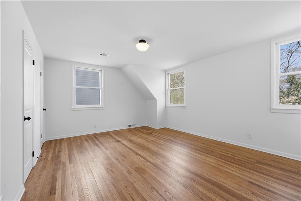 2415 Charleston Oaks Lane Decatur, GA 30030 - Photo 26 of 55 a view of empty room with wooden floor and fan