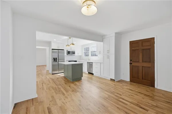 a kitchen with a sink and a fireplace
