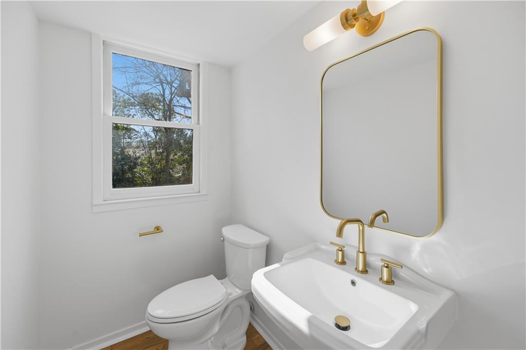 2415 Charleston Oaks Lane Decatur, GA 30030 - Photo 46 of 55 a bathroom with a sink a toilet and a mirror