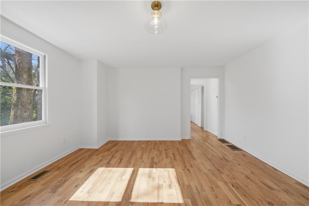 2415 Charleston Oaks Lane Decatur, GA 30030 - Photo 51 of 55 a view of a room with wooden floor and window