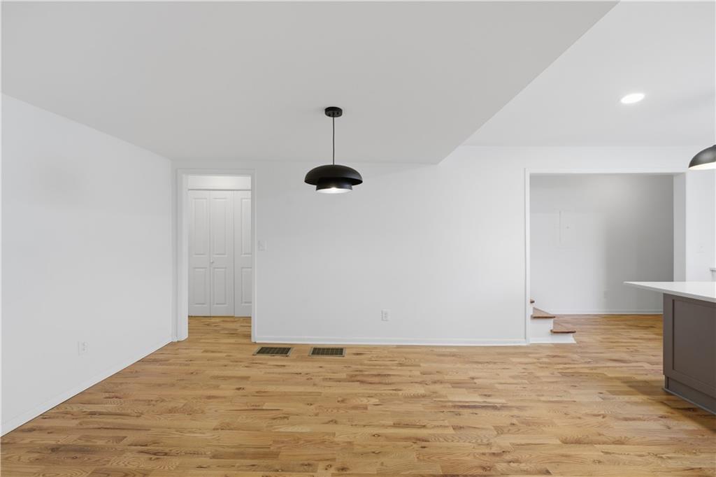2415 Charleston Oaks Lane Decatur, GA 30030 - Photo 10 of 55 a view of empty room with wooden floor