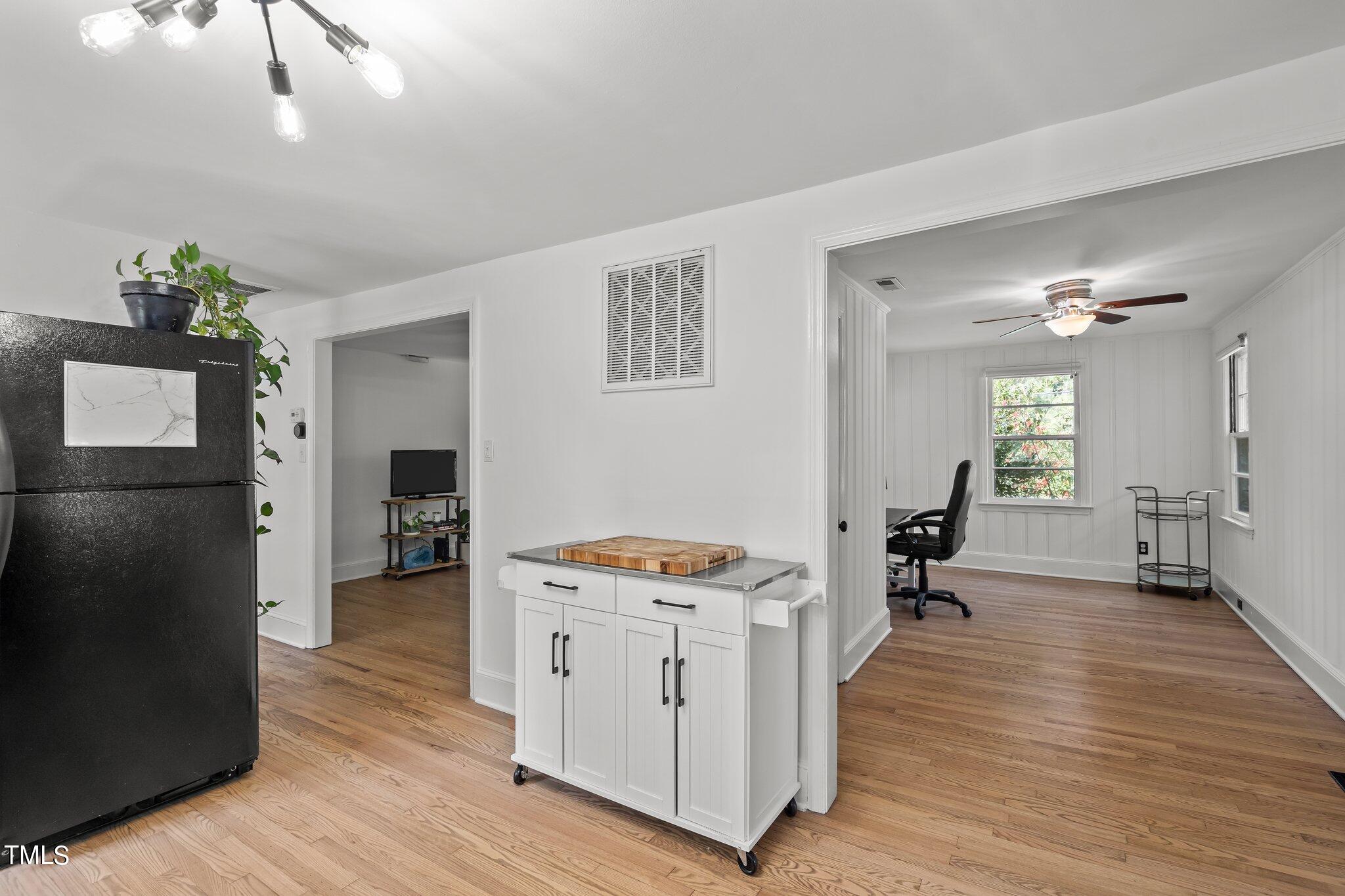 321 Jones Franklin Road Raleigh, NC 27606 - Photo 12 of 40 a room with furniture and a wooden floor