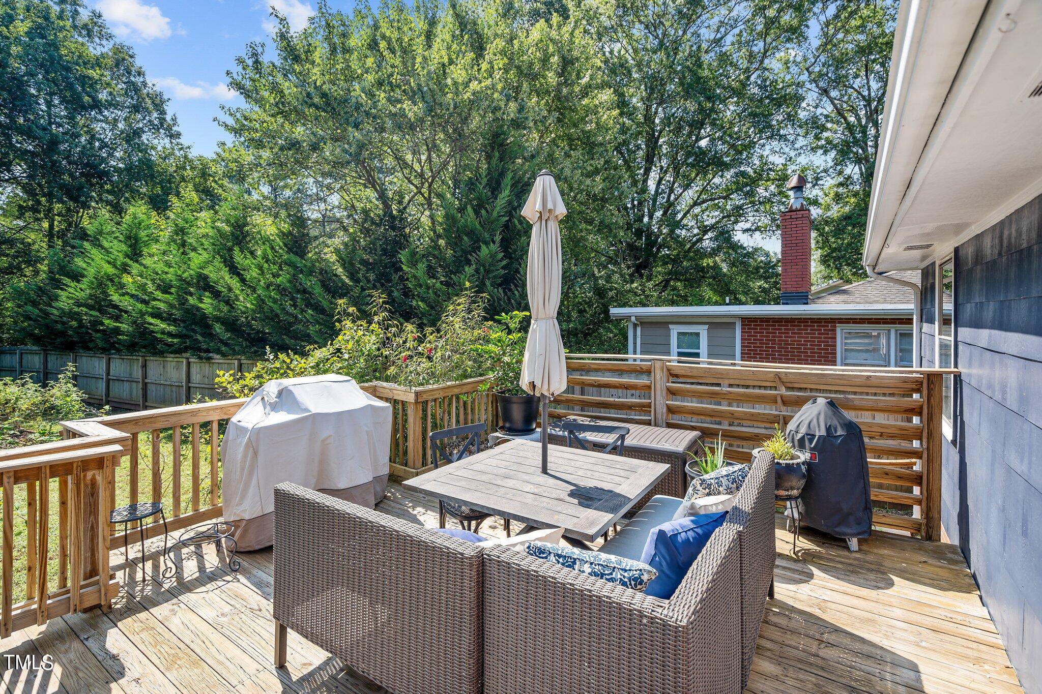 321 Jones Franklin Road Raleigh, NC 27606 - Photo 5 of 40 a view of a patio with a table and chairs