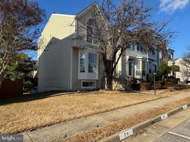a view of a house with snow on the road