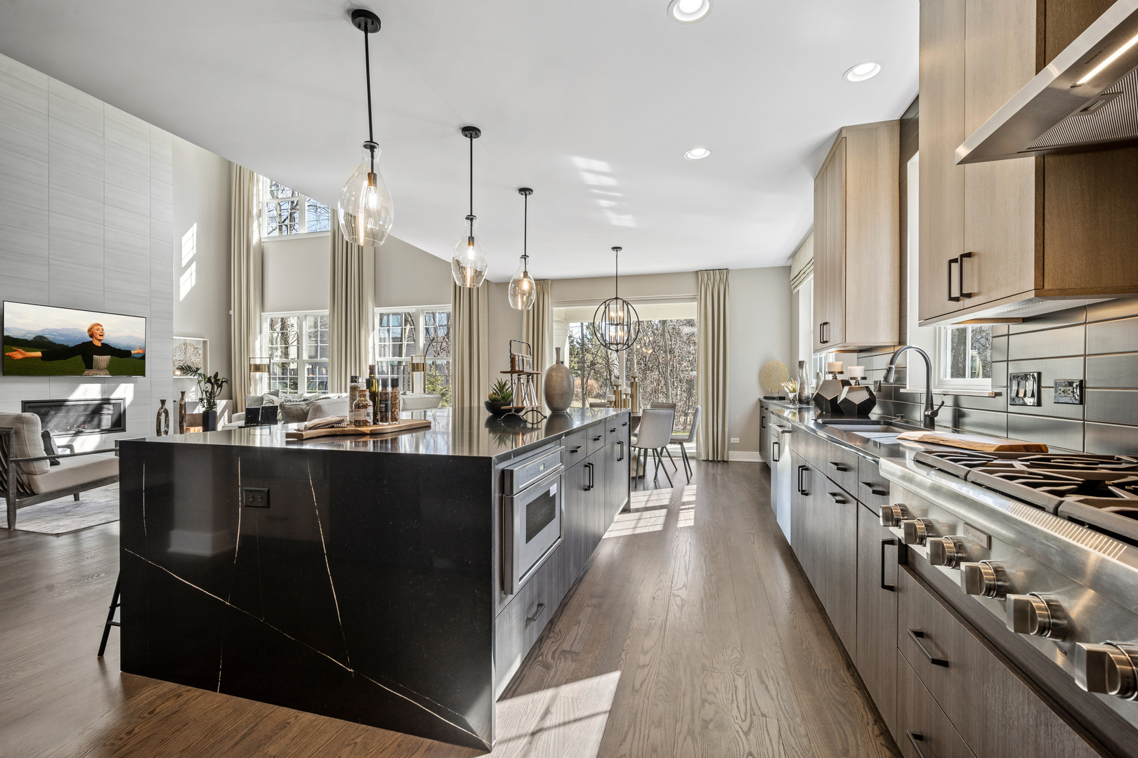 2824 Parkside Circle Glenview, IL 60026 - Photo 3 of 31 a large kitchen with stainless steel appliances a stove a sink dishwasher and a wooden cabinets with wooden floor