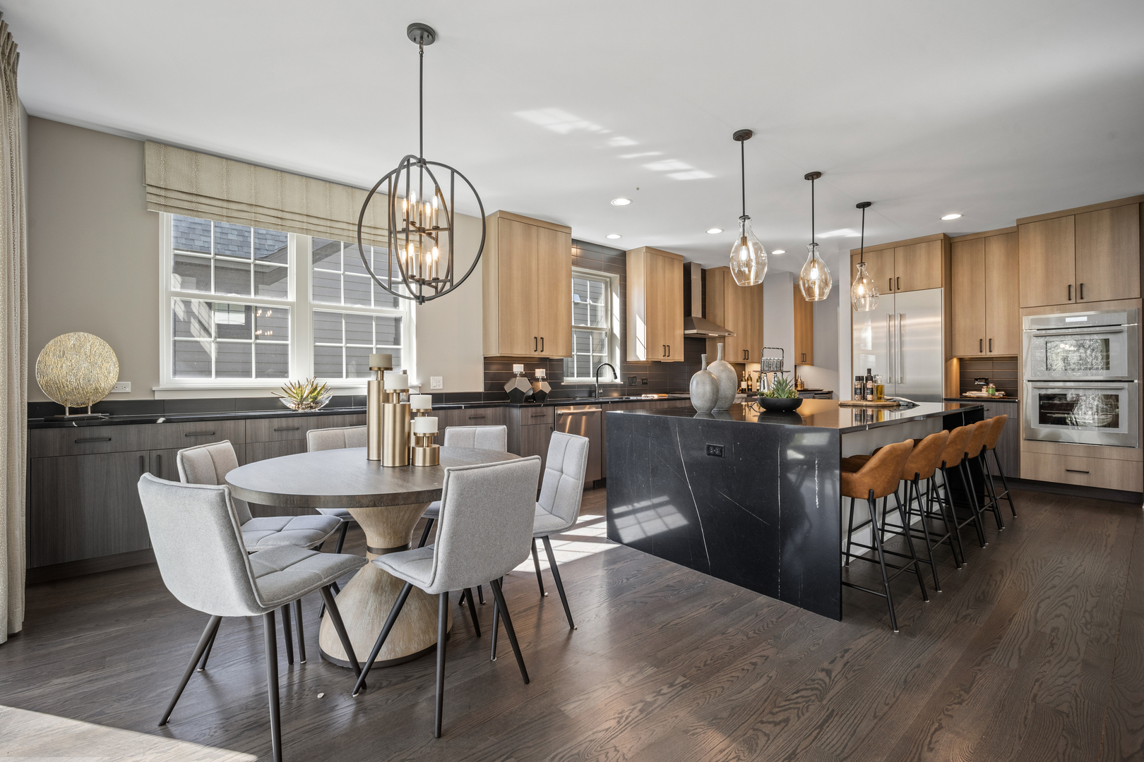 2824 Parkside Circle Glenview, IL 60026 - Photo 8 of 31 a view of dining room and livingroom with furniture wooden floor a chandelier and a rug