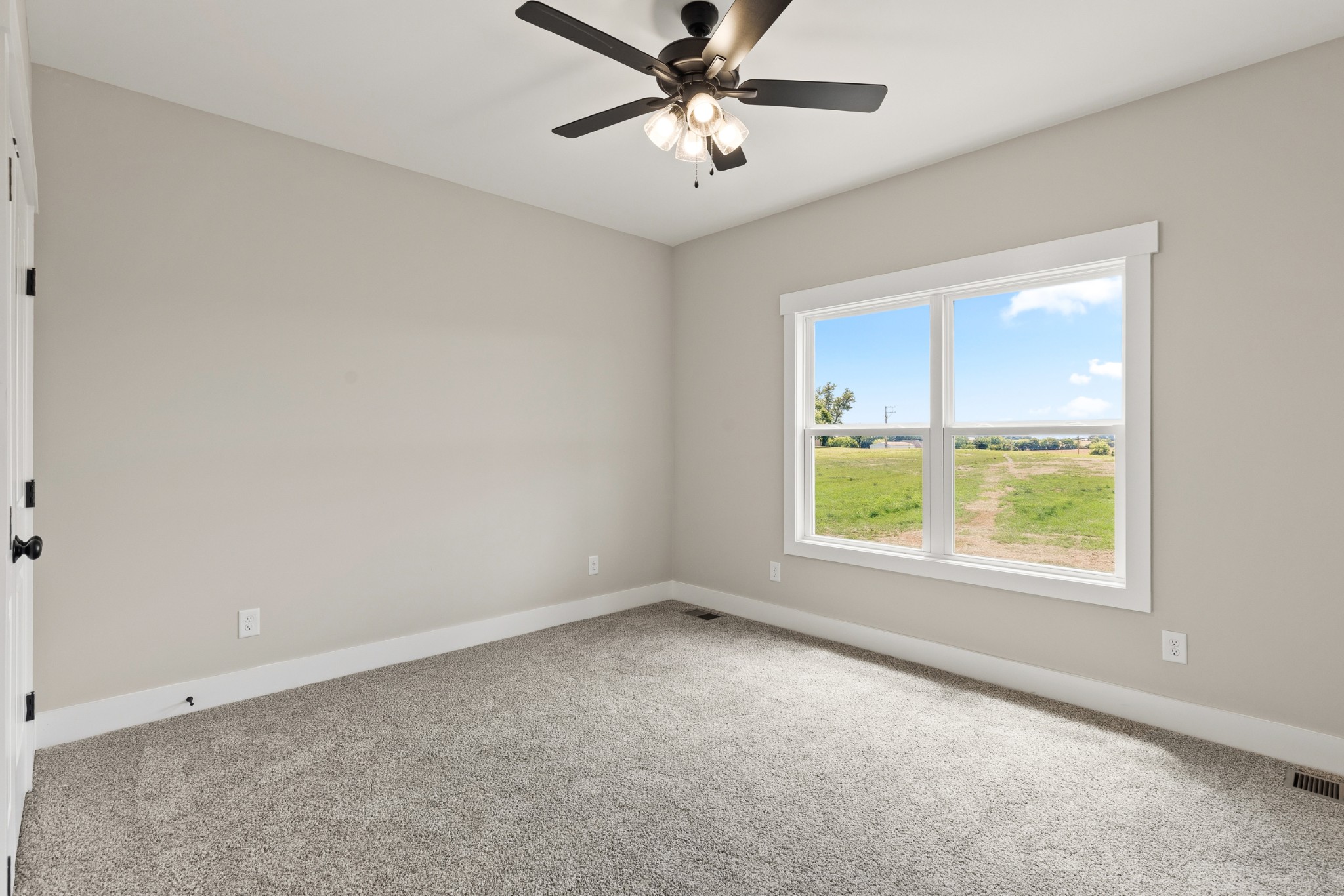 5638 Borthick Road Springfield, TN 37172 - Photo 26 of 43 an empty room with a window and a ceiling fan