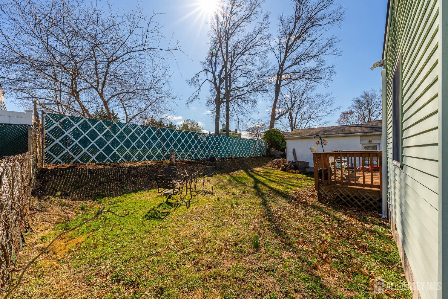 162 Rutherford Avenue Woodbridge, NJ 07095 - Photo 16 of 18 a view of a yard with wooden fence