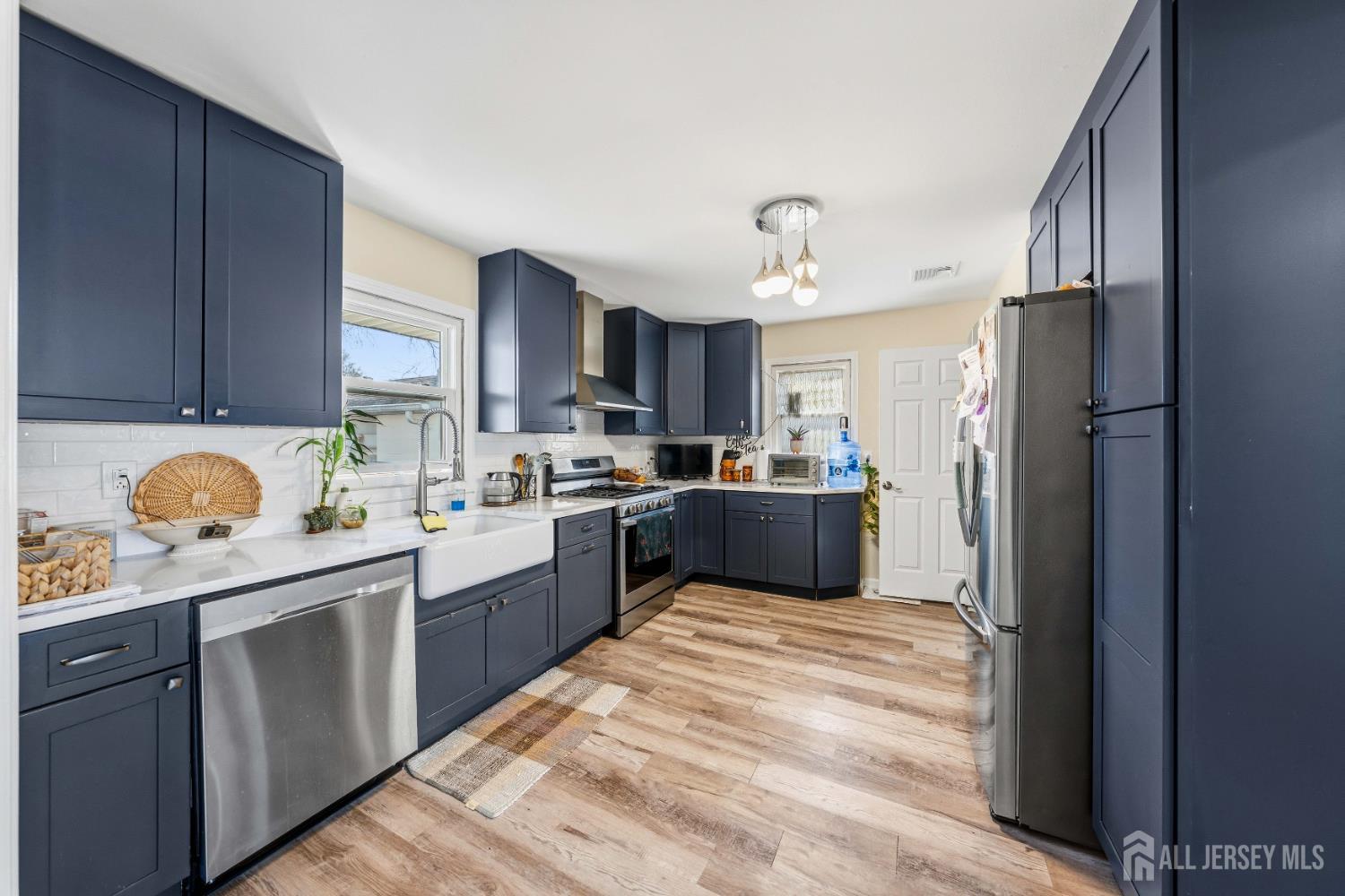 162 Rutherford Avenue Woodbridge, NJ 07095 - Photo 2 of 18 a kitchen with stainless steel appliances granite countertop a refrigerator and a stove top oven