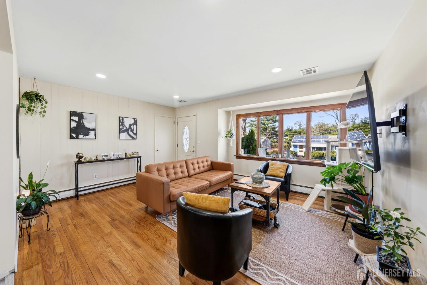 162 Rutherford Avenue Woodbridge, NJ 07095 - Photo 7 of 18 a living room with furniture and a large window
