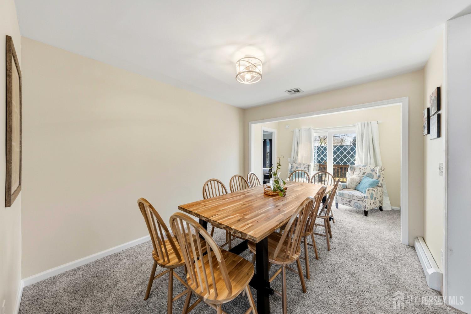 162 Rutherford Avenue Woodbridge, NJ 07095 - Photo 8 of 18 a view of a dining room with furniture and a window
