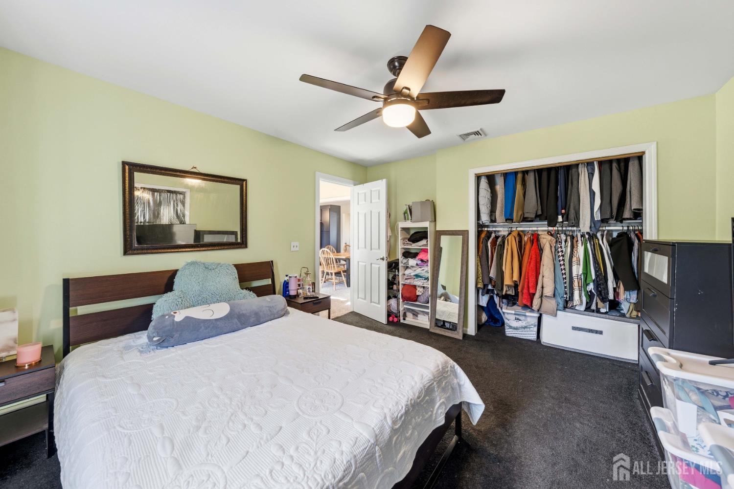 162 Rutherford Avenue Woodbridge, NJ 07095 - Photo 10 of 18 a bedroom with a bed and a walk in closet