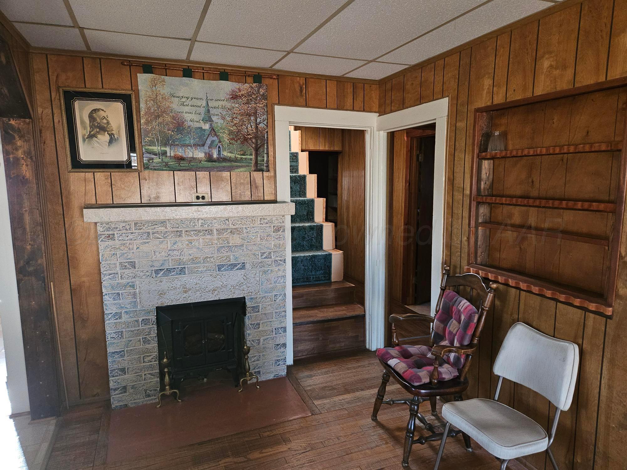 201 Oak Avenue Panhandle, TX 79068 - Photo 12 of 44 a living room with furniture and a fireplace