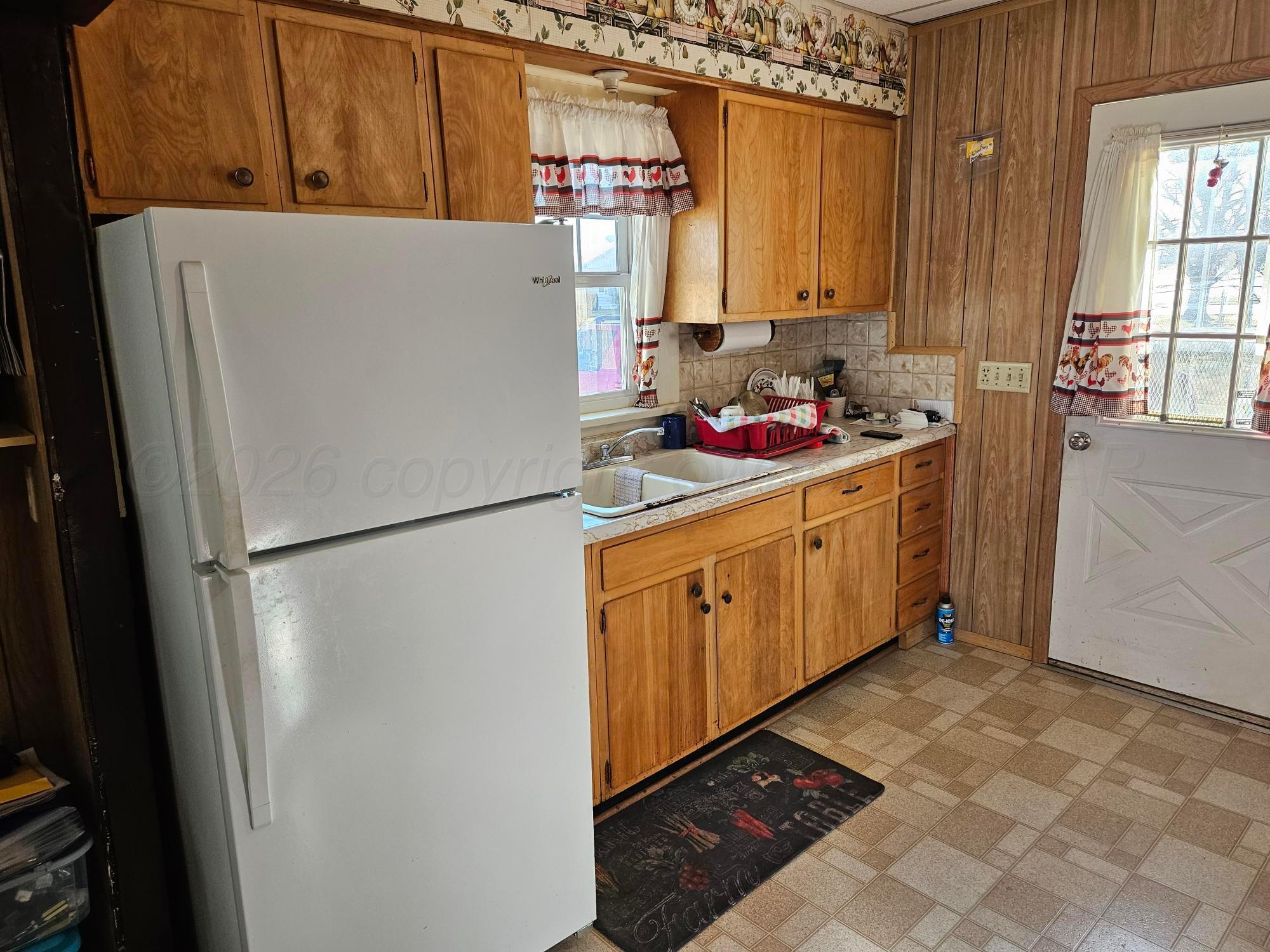 201 Oak Avenue Panhandle, TX 79068 - Photo 19 of 44 a white refrigerator freezer sitting inside of a kitchen