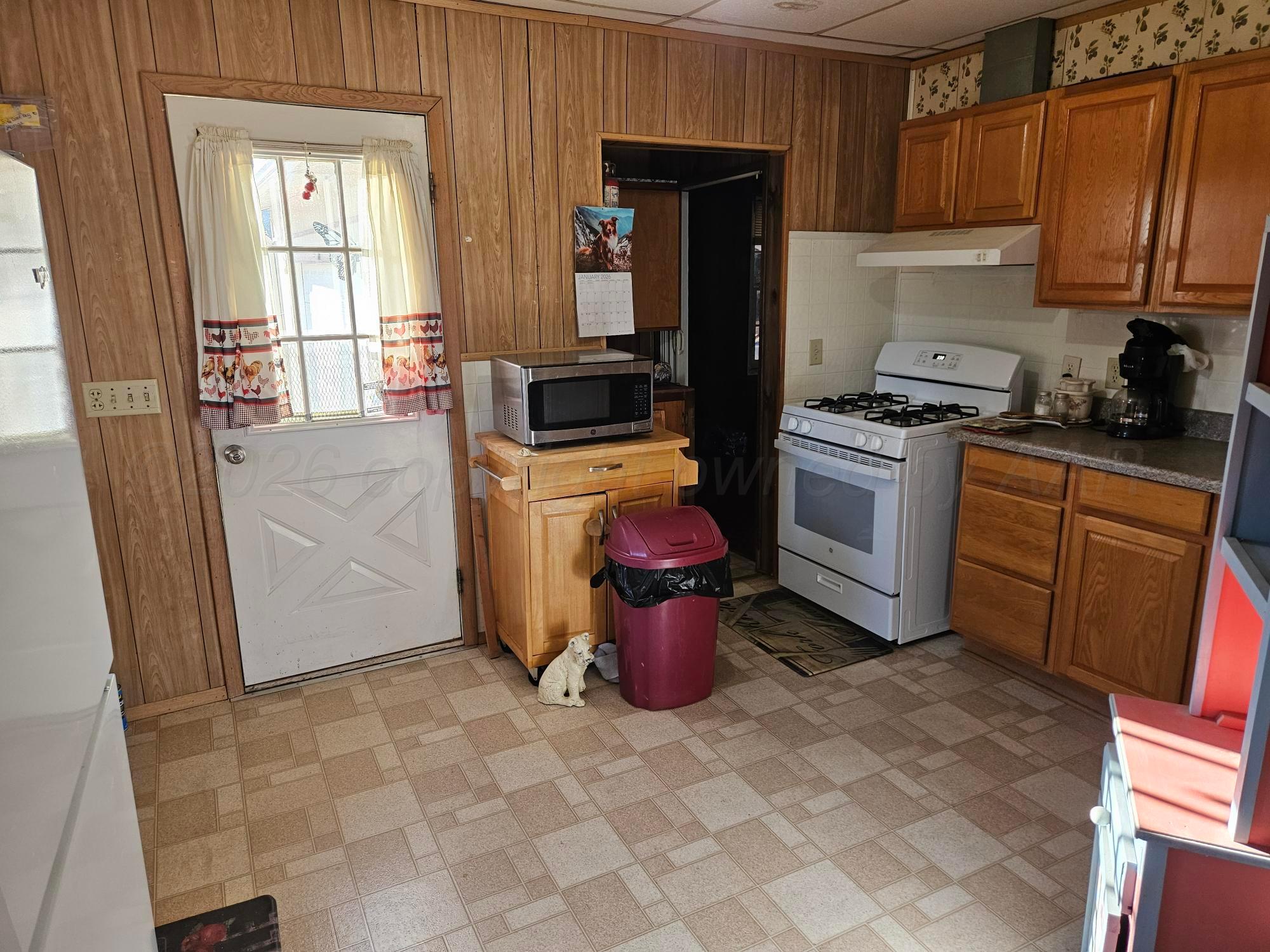 201 Oak Avenue Panhandle, TX 79068 - Photo 20 of 44 a kitchen with a sink stove and refrigerator