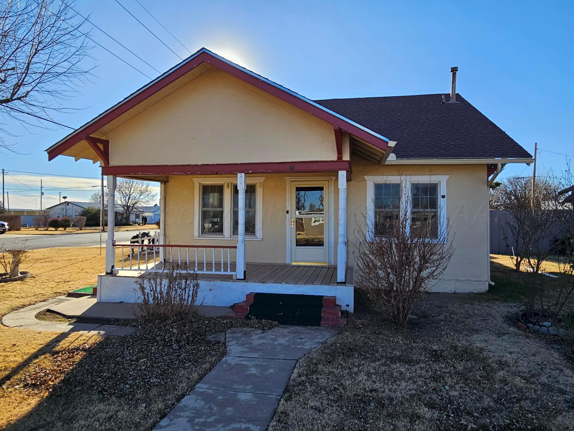 201 Oak Avenue Panhandle, TX 79068 - Photo 2 of 44 a front view of a house with garden