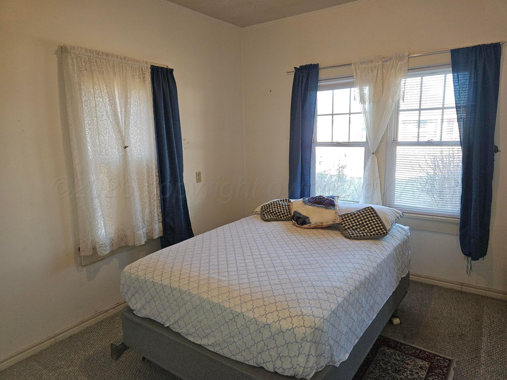 201 Oak Avenue Panhandle, TX 79068 - Photo 25 of 44 a bedroom with a bed and a window