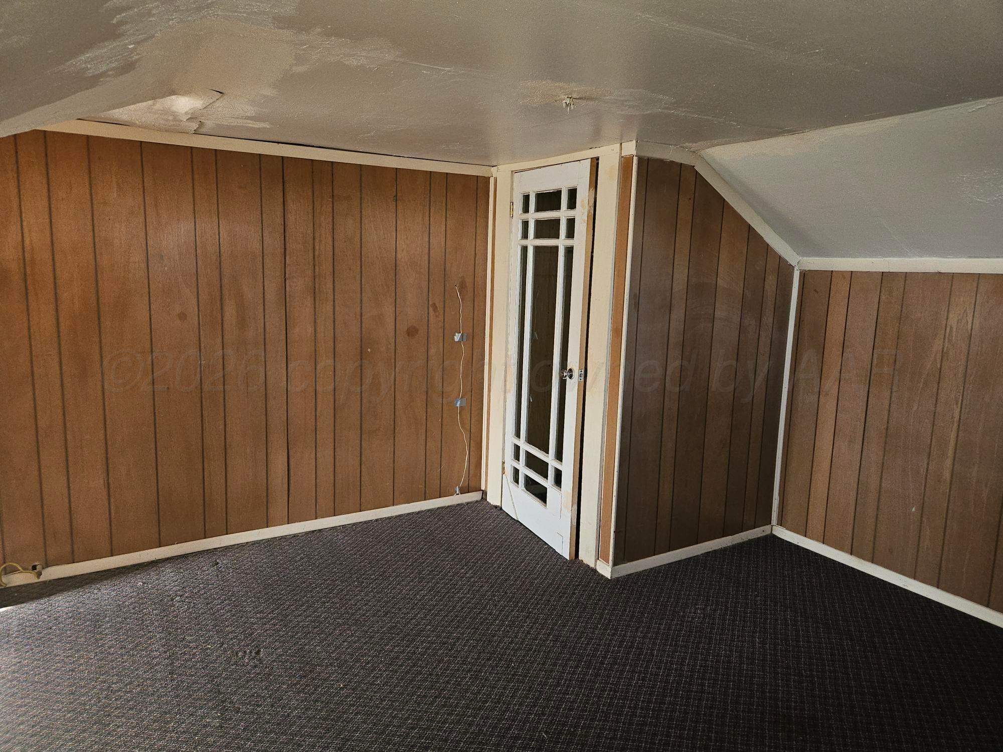 201 Oak Avenue Panhandle, TX 79068 - Photo 38 of 44 an empty room with a wooden door