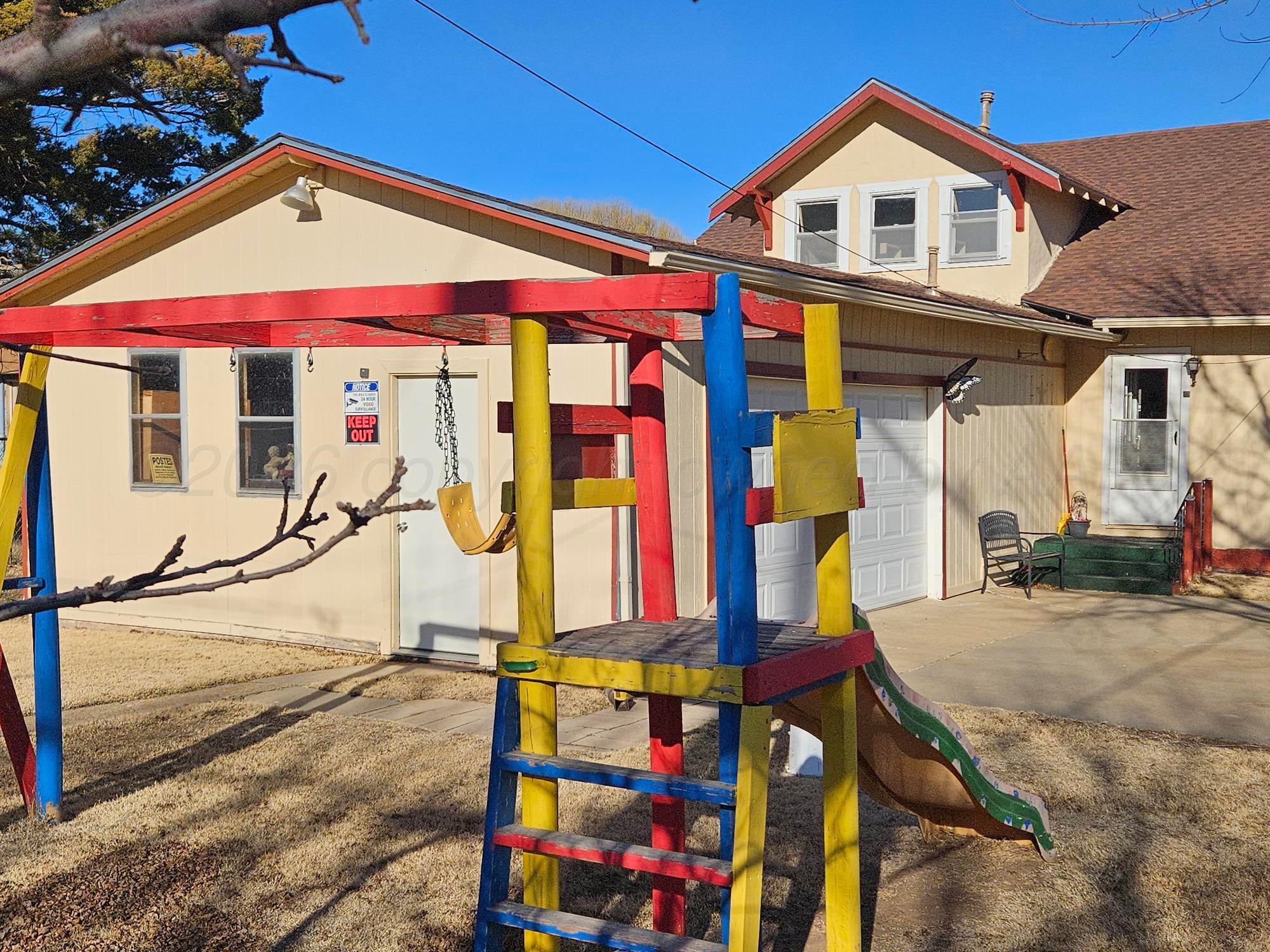 201 Oak Avenue Panhandle, TX 79068 - Photo 5 of 44 a view of a house with large windows