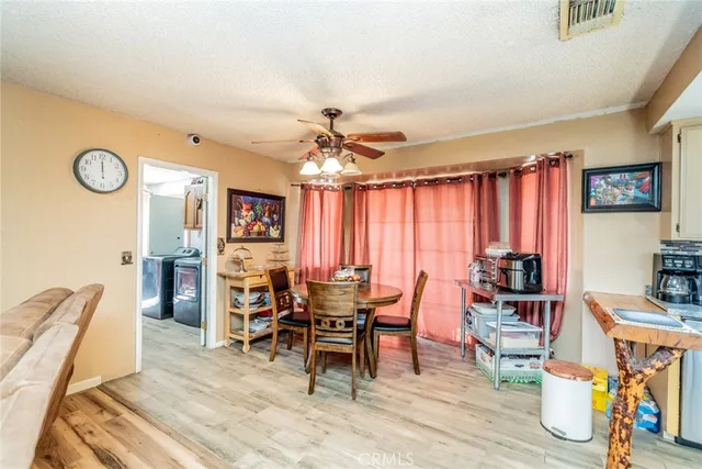 a view of a livingroom with furniture and window