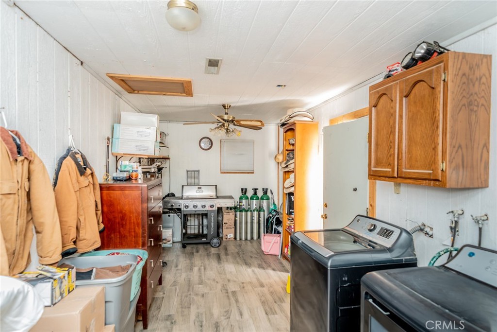 4637 Luna Road Phelan, CA 92371 - Photo 18 of 43 a view of a workspace with furniture and wooden floor