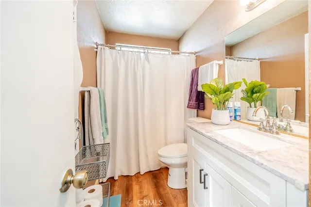 a view of bathroom with a tub sink a mirror and a shower