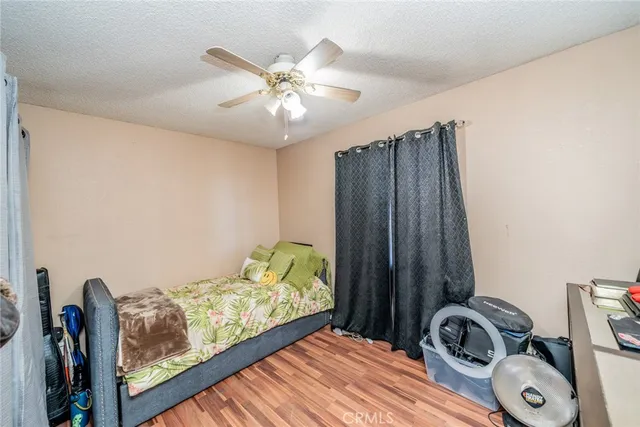 a bedroom with a bed and a mirror