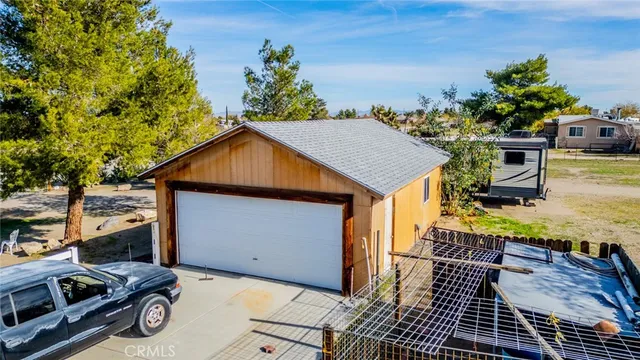 a view of a house with backyard and swimming pool
