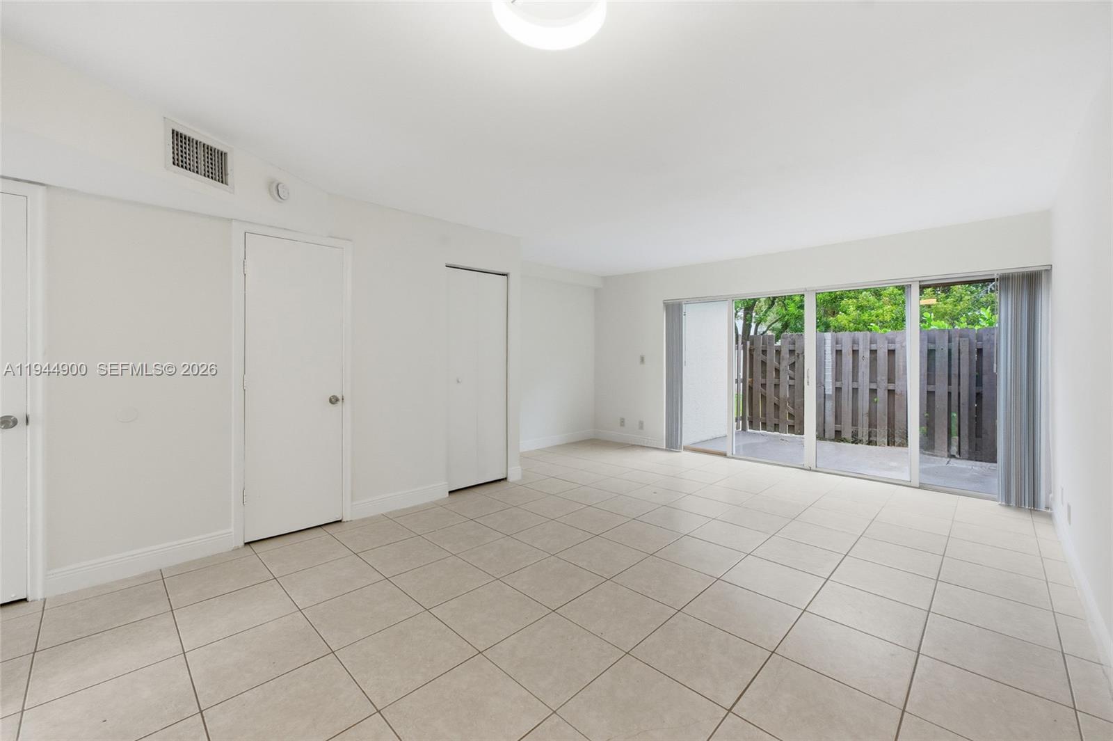 3003 Northwest 5th Terrace, Unit 2 Pompano Beach, FL 33064 - Photo 11 of 28 a view of an empty room with a window