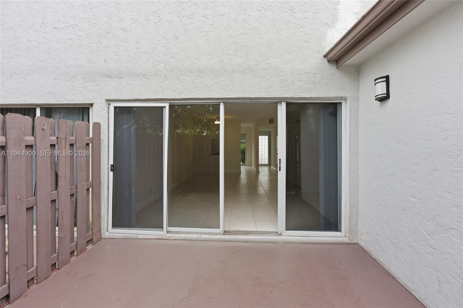 3003 Northwest 5th Terrace, Unit 2 Pompano Beach, FL 33064 - Photo 25 of 28 wooden floor and window in a room