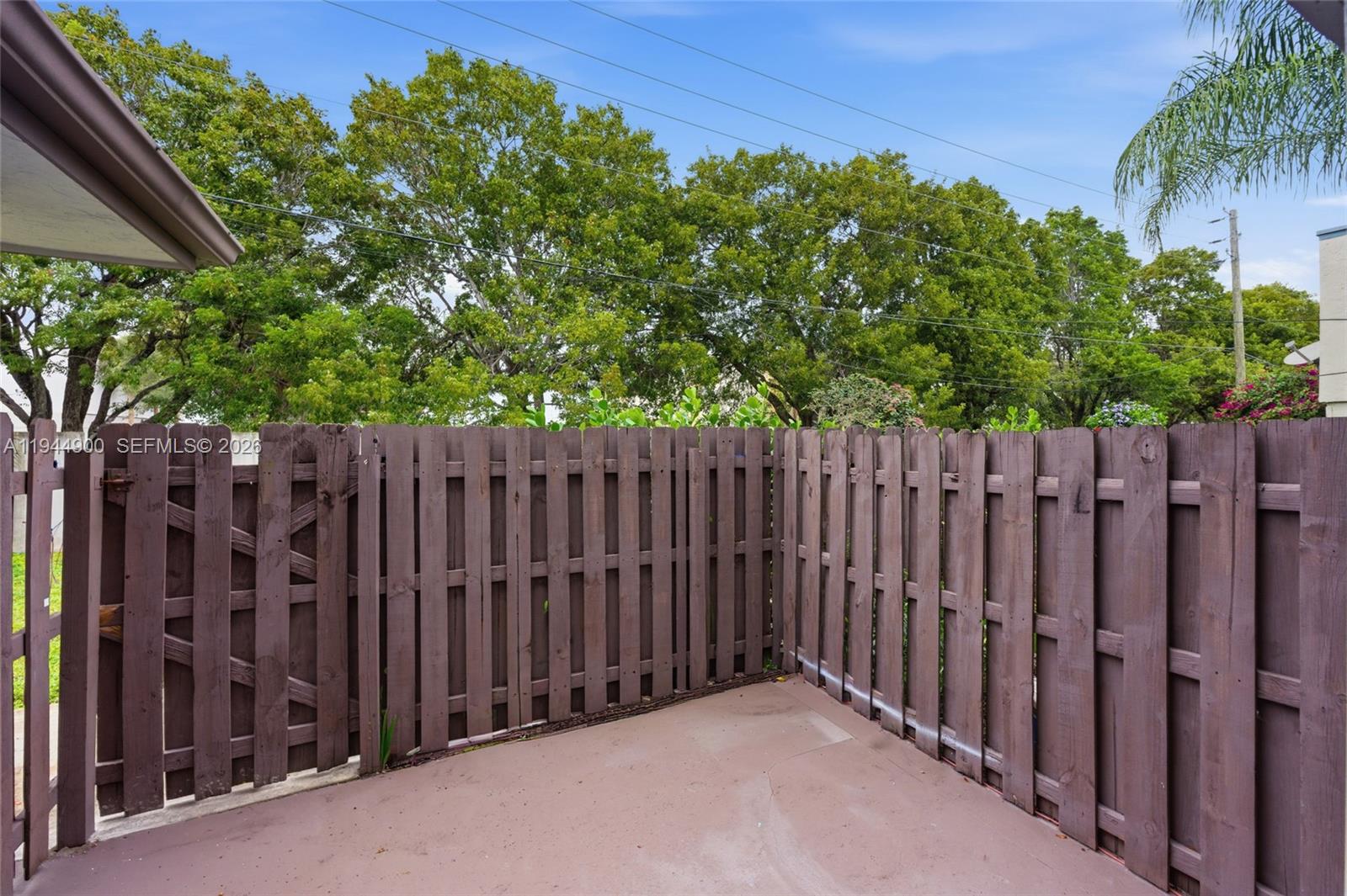 3003 Northwest 5th Terrace, Unit 2 Pompano Beach, FL 33064 - Photo 26 of 28 a view of wooden fence