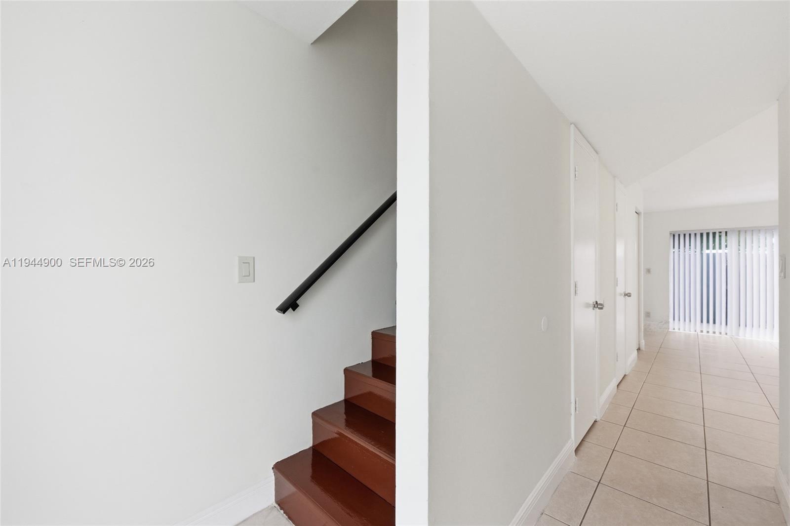 3003 Northwest 5th Terrace, Unit 2 Pompano Beach, FL 33064 - Photo 3 of 28 a view of entryway and hall with wooden floor